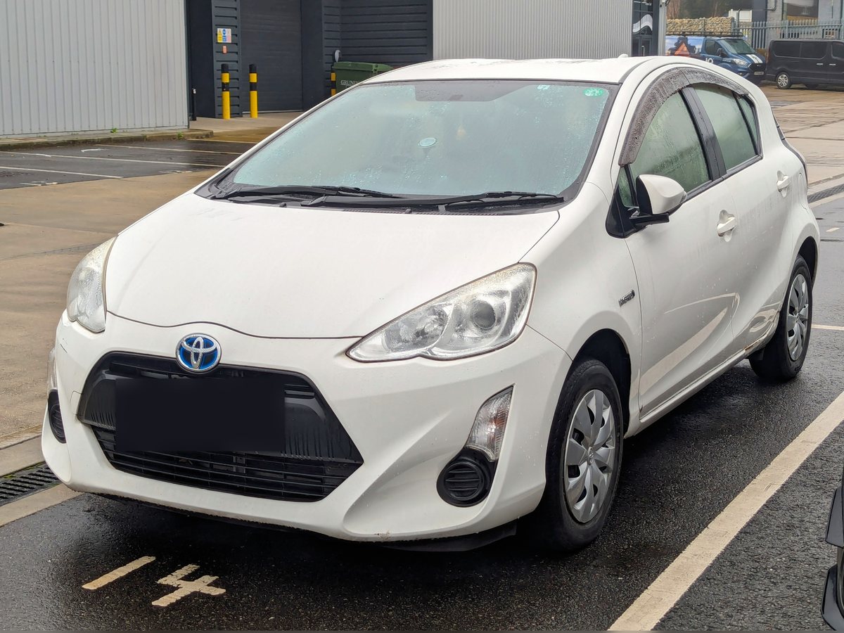 Example photo: white Toyota Aqua 2016, front three-quarter view. Not the actual car.